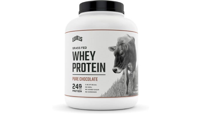 A large container of Levels why protein powder with a picture of a cow on it