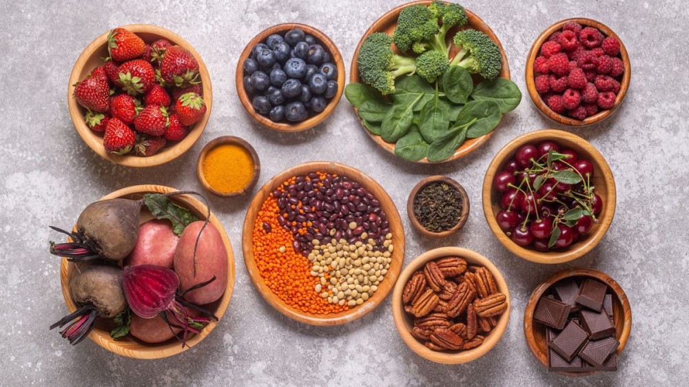 A variety of fruits, vegetables, and whole grains on a table.