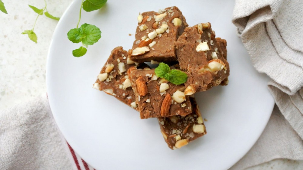 Nut flour brownies on a white plate.