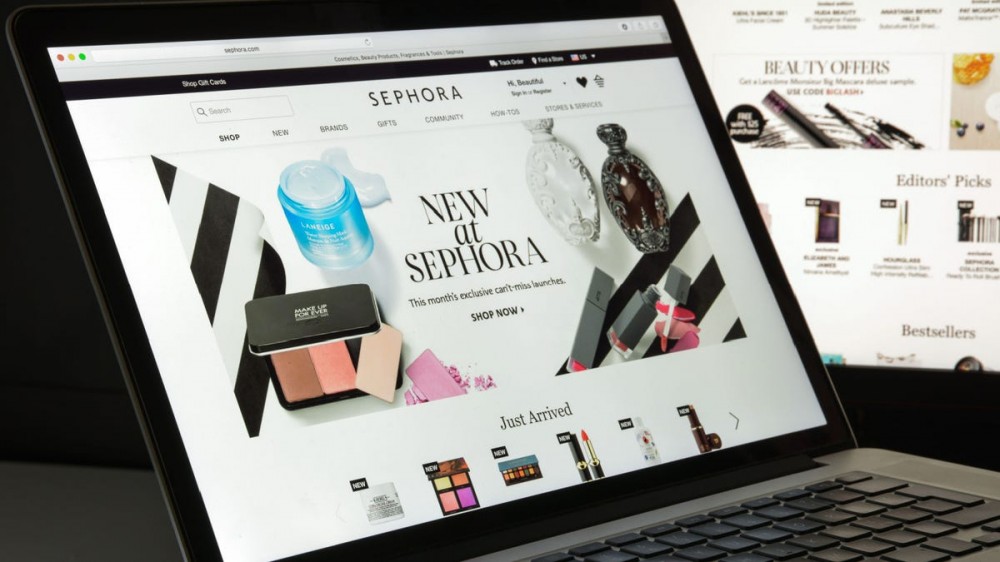 The Sephora website is pulled up on a black laptop.