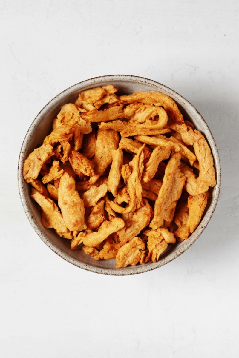 An overhead image of a ceramic bowl, which has been filled with a vegan protein.